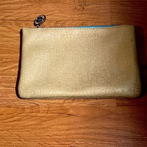 Bright gold and blue color with a cute sun zipper